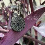 Customized pendant engraved with song lyrics for a birthday gift